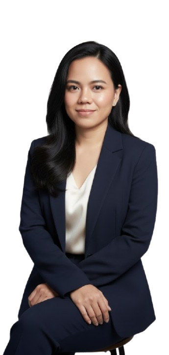 Professional portrait of a woman wearing a navy blazer, seated against a light grey studio background.